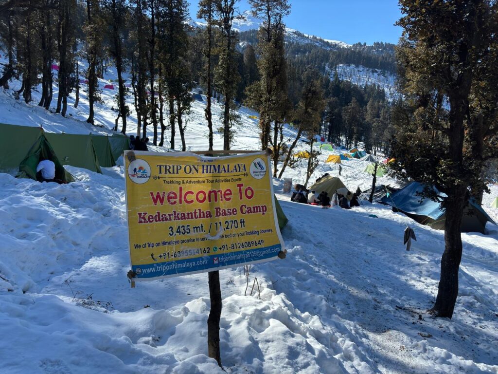 Snow-covered Kedarkantha Base Camp with towering peaks in Uttarakhand